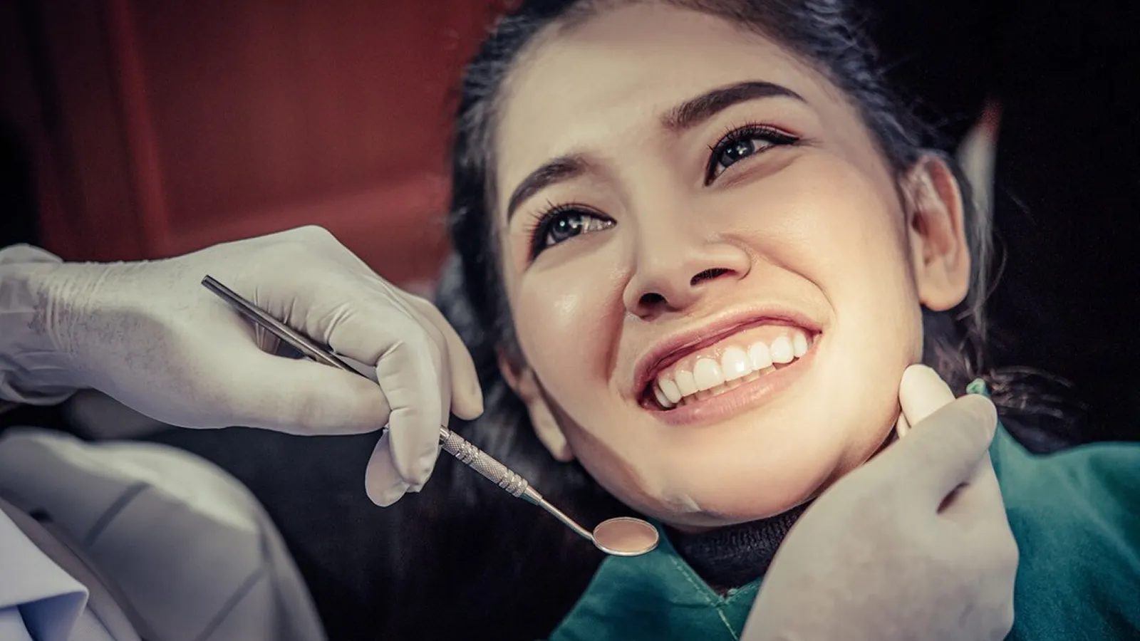 Patient in dental chair during teeth extraction consultation