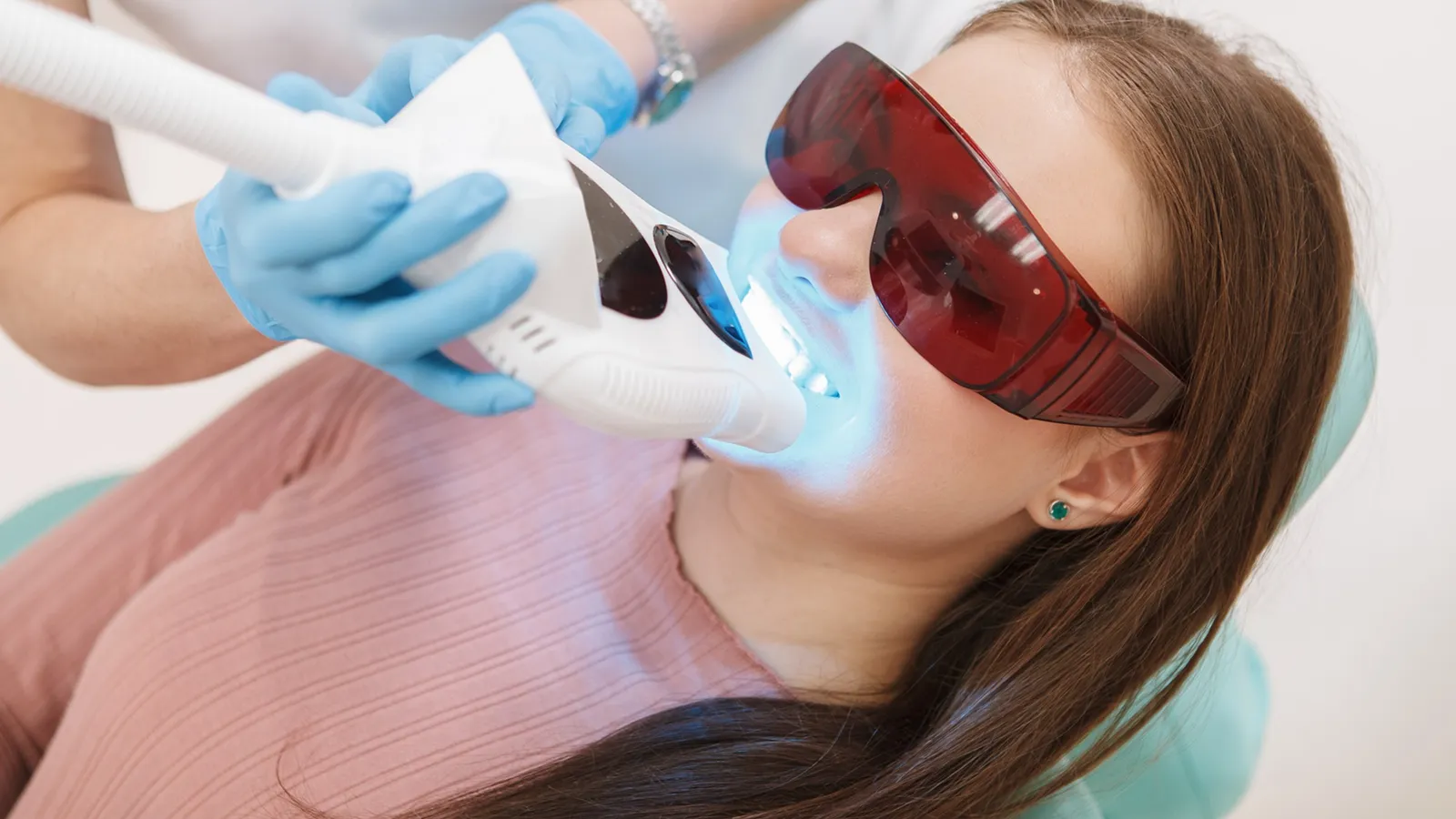 Patient in dental chair during teeth extraction consultation