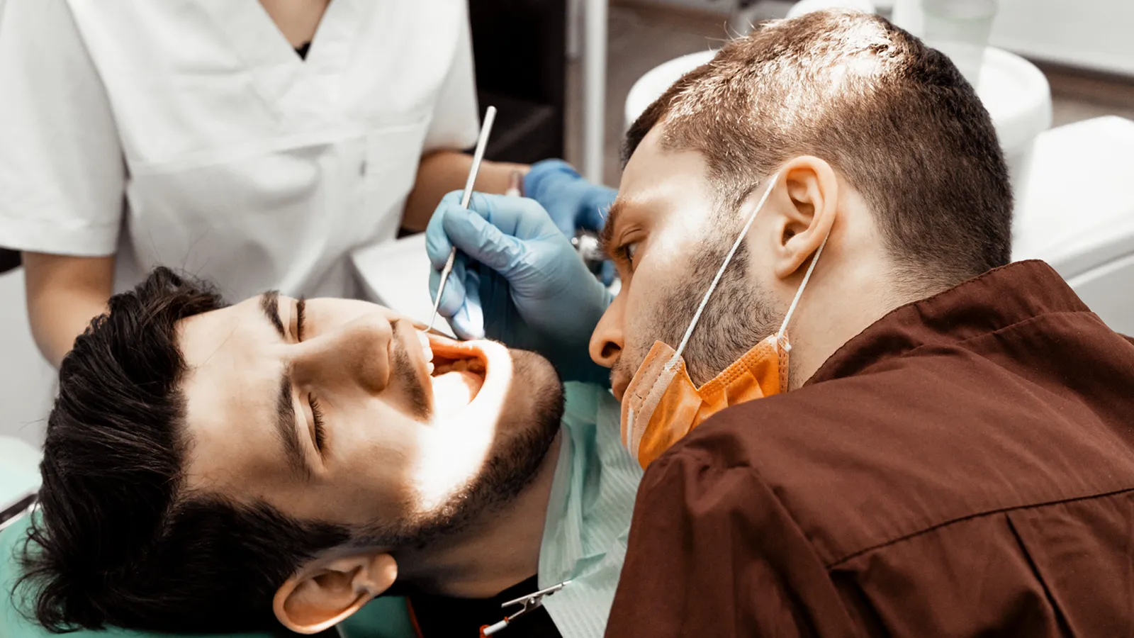 Patient in dental chair during teeth extraction consultation