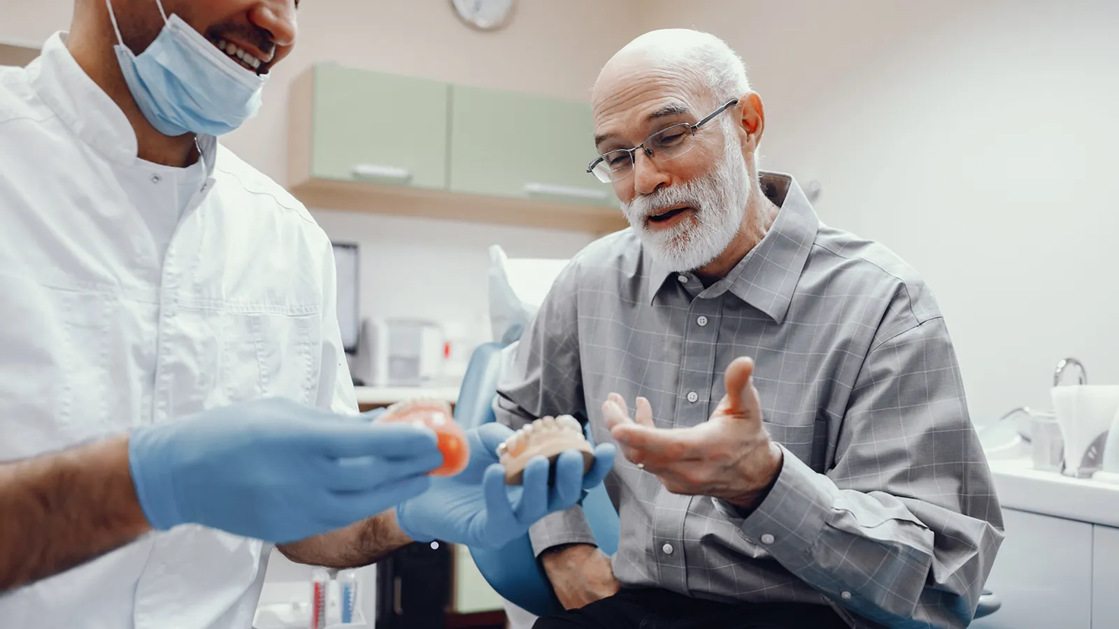 Patient in dental chair during teeth extraction consultation